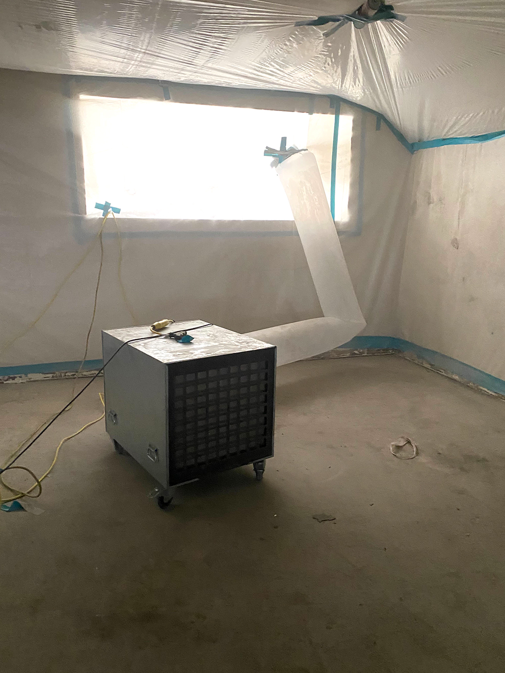 Controlled interior work area with air-filtration equipment