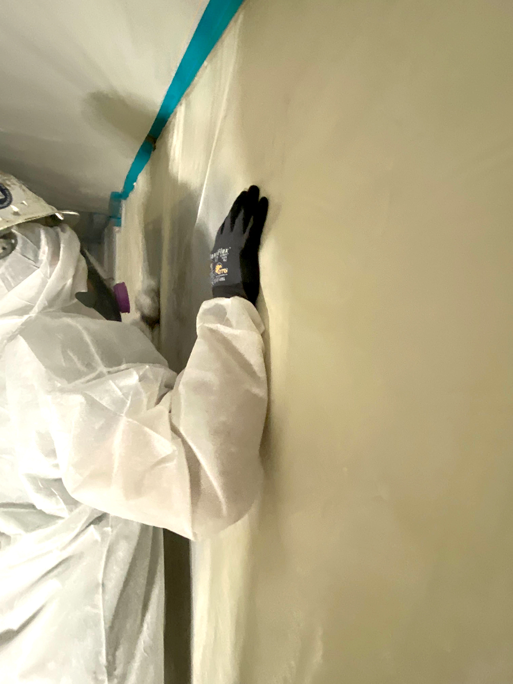 JJ&S technician completing detailed work inside containment
