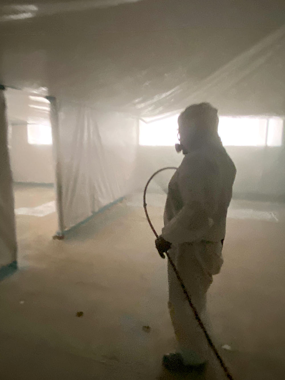 Technician performing field work inside containment