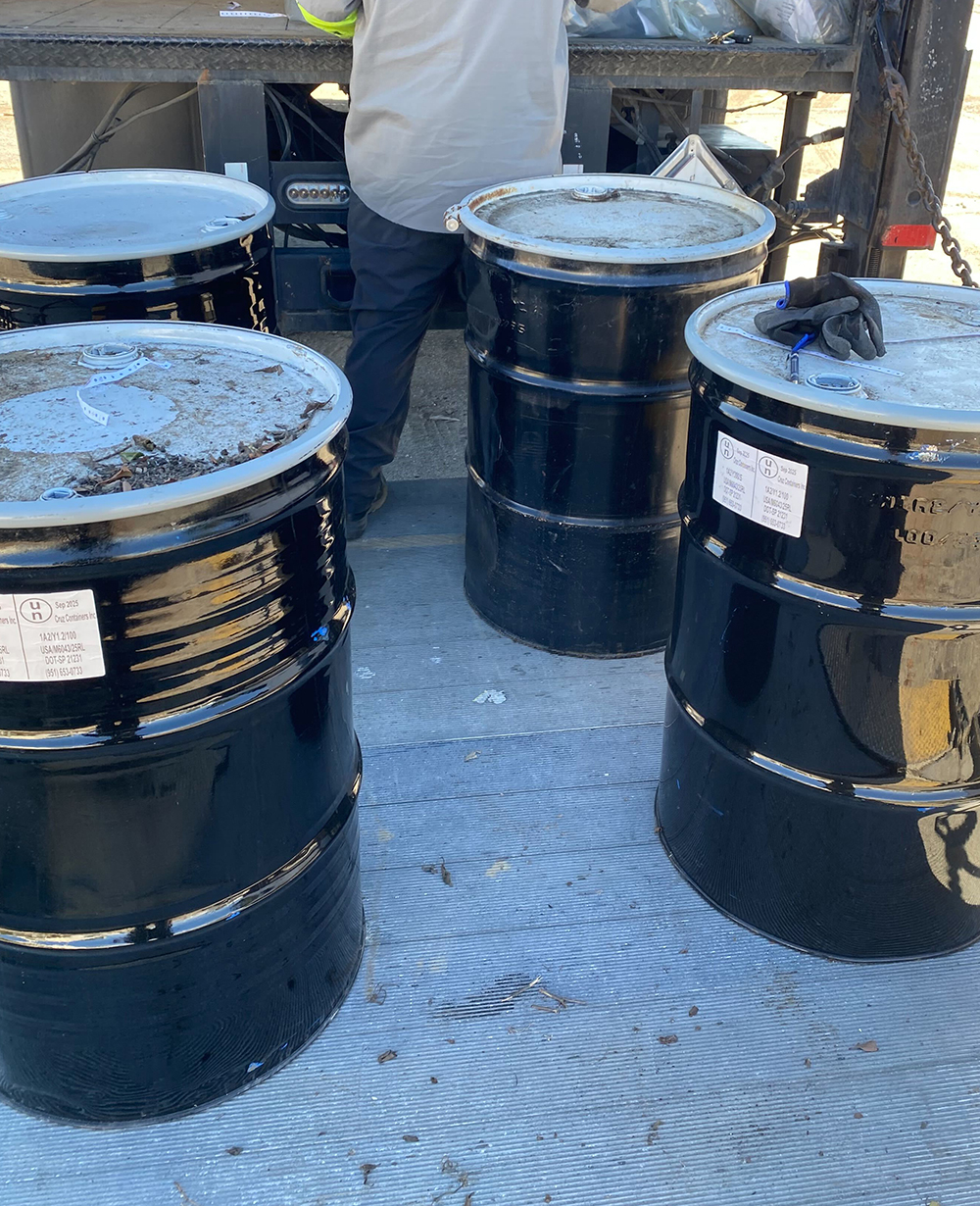 Labeled hazardous-material containers prepared for handling