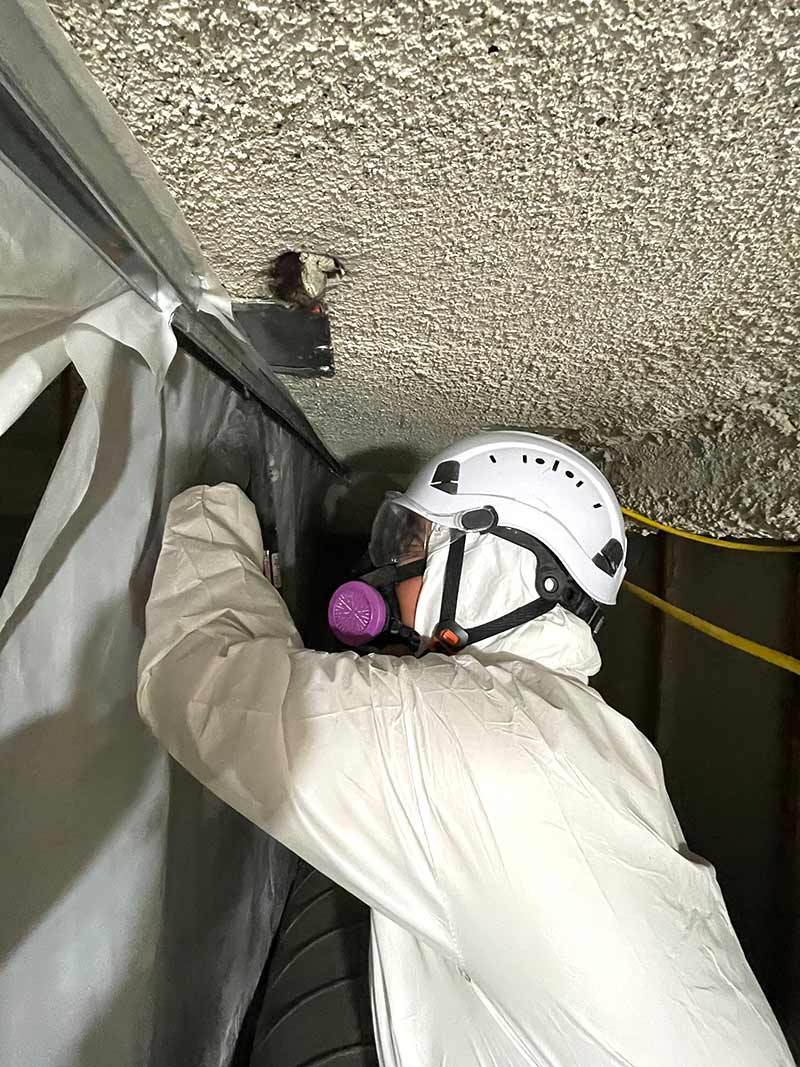 Technician working on the San Diego healthcare asbestos project